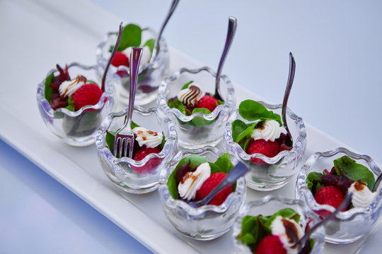 appetizer with cream cheese, raspberry and beet leaves