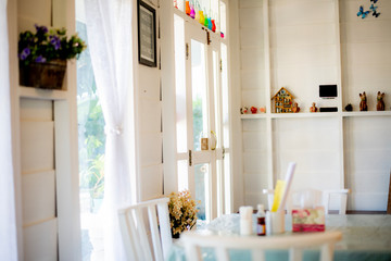 The rooms are decorated in a vintage white style