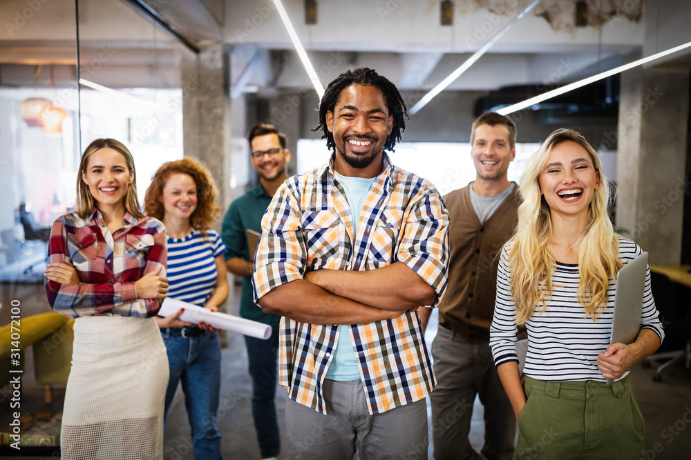 Wall mural Successful company with happy employees in modern office