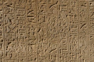 Egyptian ancient hieroglyphs on the stone wall