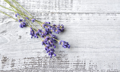 Bunch of fresh natural lavender flowers on old rustic wooden table