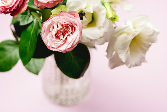 Beautiful Flowers in a Vase Spring Background White and Pink Flowers on Pink Background Copy Space Horizontal Pink Roses and Eustoma Holiday Card