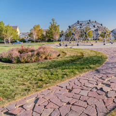 Square frame Curved path with crazy paving in a park