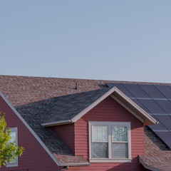 Fototapeta na wymiar Square frame Array of photovoltaic solar panels on a roof