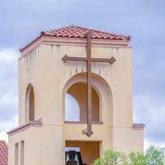 Fototapeta na wymiar Square Modern bell tower on a small church