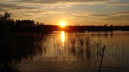 Fototapeta na wymiar Sunrise on lake (Lough Derg) from Canoe