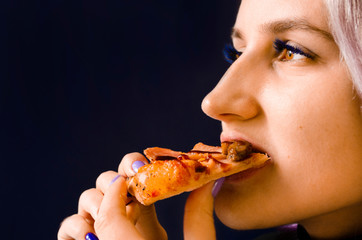 Girl eating pizza. Not healthy food. Home delivery.