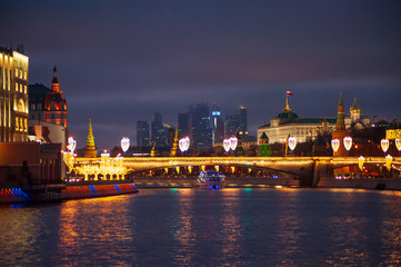 Fototapeta na wymiar Moscow, Russia - January 03, 2020: View of the Moscow Kremlin and the Moskva river in the evening with Christmas illumination.