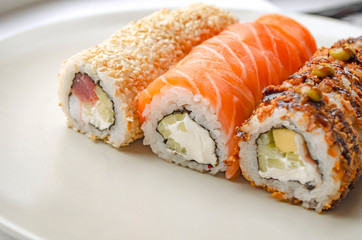 Japanese cuisine. Rolls on a plate. Philadelphia.