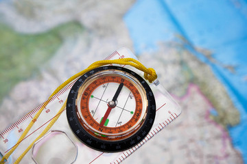Naklejka premium Compass on a map background.