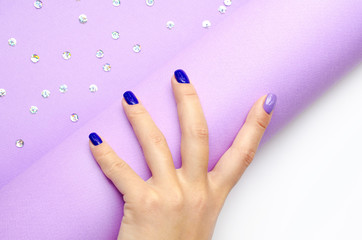 Stylish trendy women's manicure. Blue and lilac