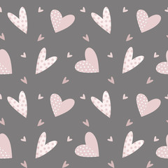 Seamless pattern of pink hearts for Valentine's day on gray background.