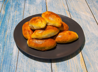 Pies with stewed cabbage and carrots baked in the oven