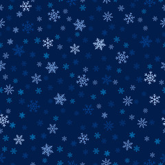 Winter seamless pattern. Christmas background with delicate snowflakes scattered on blue backdrop. Elegant vector texture. Festive winter holiday theme. Subtle abstract repeat design for decor, cover