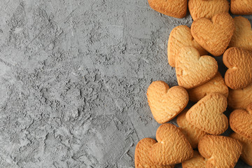 Heart shaped cookies on grey background, space for text
