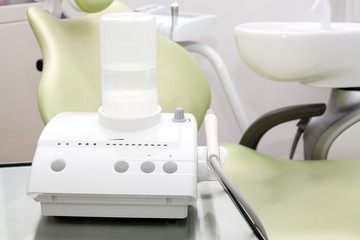 Ultrasound for professional dental cleaning. The concept of dental equipment.