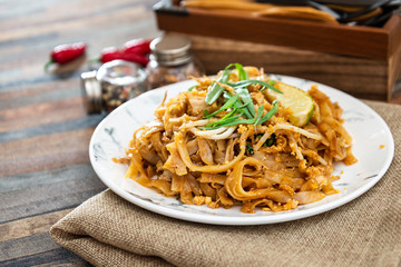 Pad Thai, vegan recipe made with rice noodles, vegetables and peanuts cooked on wok