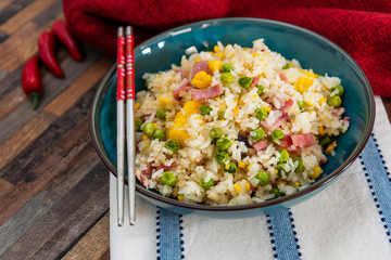 Homemade Chinese fried rice with vegetables and fried eggs