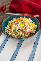 Homemade Chinese fried rice with vegetables and fried eggs