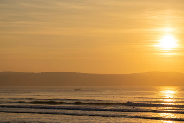 Surfers Waiting in Late Afternoon Sun