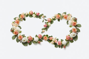 Flowers roses wreath in the shape of figure eight.