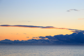 Bright cumulus clouds against the blue sky. Sunset sky Natural background. seascape