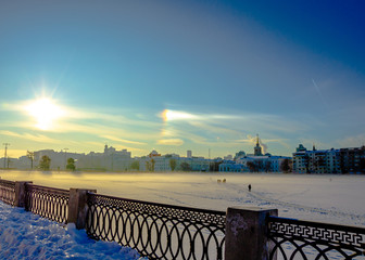 Solar halo on a winter day over the city.