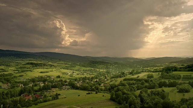 Scenic, dramatic landscape with stormy clouds at sunset. Poland, Europe. Beskid Mountains (Beskidy). Aerial, drone video.