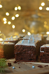 Gingerbread cake with icing on a wooden background