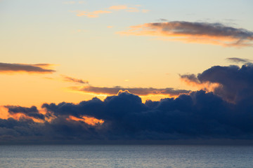 Bright cumulus clouds against the blue sky. Sunset sky Natural background. seascape