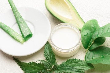 Obraz na płótnie Canvas Natural aloe vera and avocado cosmetic closeup image. Handmade skin care products. Facial treatment preparation and refreshing cream background. flat lay composition with natural cosmetic products.