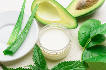 Natural aloe vera and avocado cosmetic closeup image. Handmade skin care products. Facial treatment preparation and refreshing cream background.  flat lay composition with natural cosmetic products.
