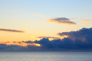 Bright cumulus clouds against the blue sky. Sunset sky Natural background. seascape