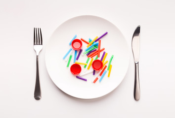 Plastic waste ready to eat on a plate set for lunch