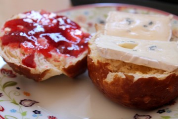 Home made German Pretzel Bread with Strawberry Jam and Mould Cheese