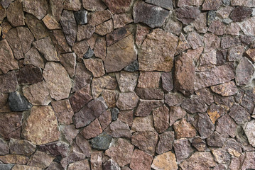 Texture: a wall of folded natural stone, reinforced with a small amount of cement.