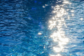 Water in swimming pool rippled water detail background