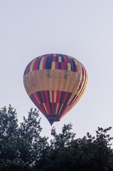 Fototapeta premium hot air balloon is flying at sunrise. romantic balloon flights