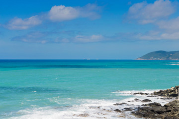 Beautiful cerulean sea and the rocky beach, Tyrrhenian sea in Tuscany, Italy