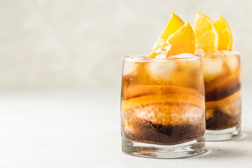 Cold refreshing summer coffee orange cocktail. Selective focus, space for text.