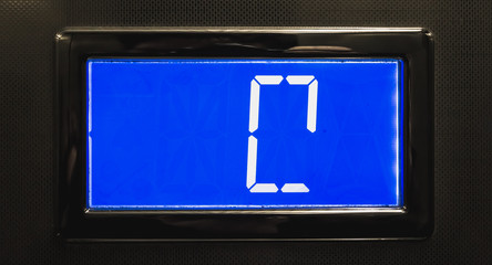 broken blue LCD display showing 0  in elevator