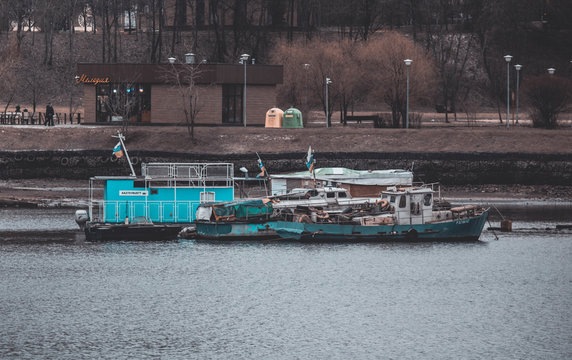 Old boats and barges in the river parking