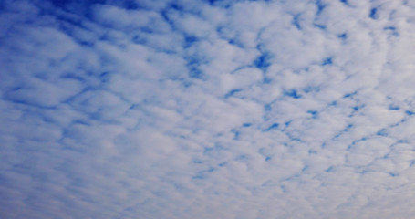 White clouds with blue sky background.
