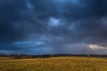 Fototapeta na wymiar Stormy day with rain falling in the sky