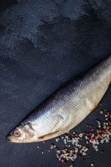 herring (healthy food, salted raw fish and spices) menu concept. food background. top view. copy space