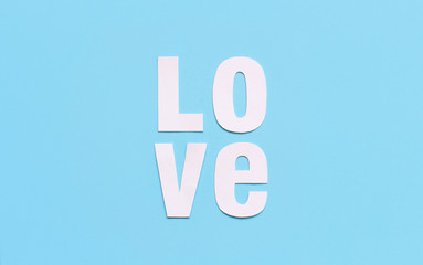 Text LOVE on a light blue background