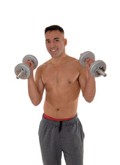 Fototapeta na wymiar Close-up of a man with two dumbbells working out