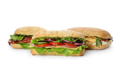 Delicious sandwiches with fresh vegetables isolated on white