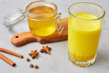 Turmeric latte with milk and cinnamon sticks, anise stars and honey. fat burner in the liver, increased immunity, anti-inflammatory healthy detox drink