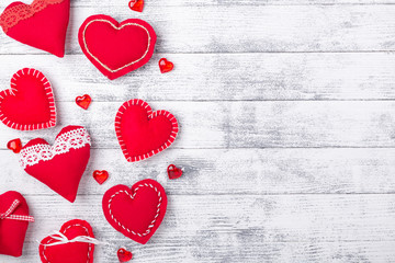 Red hearts on wooden white background. The concept of Valentine Day. Copy space for your text